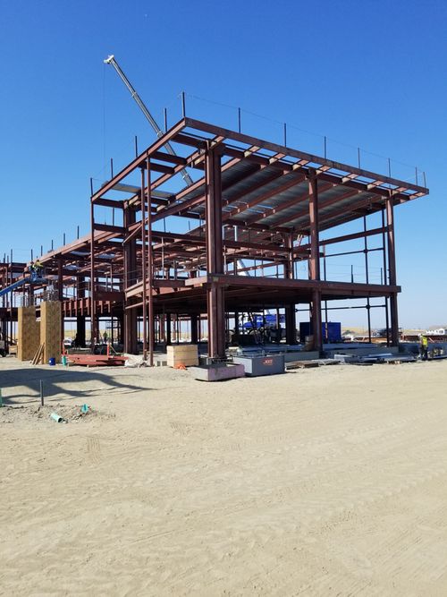 Steel frame and roofing of an elementary school under construction.