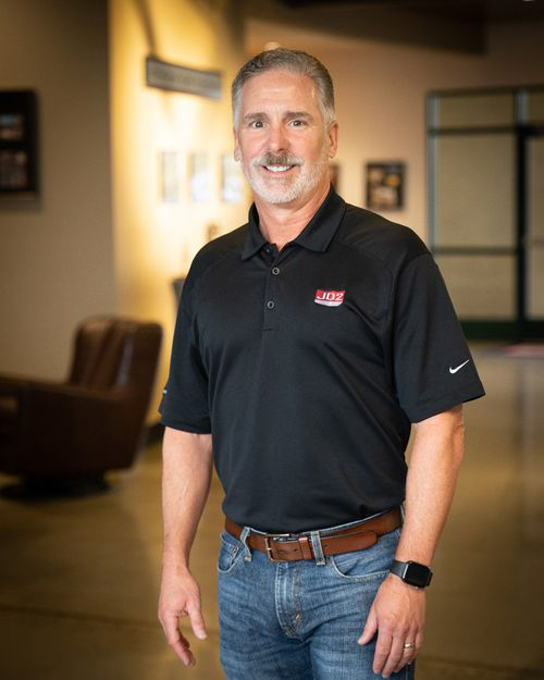 Ross Jeffery, JD2 CEO, standing in JD2's Auburn Office.